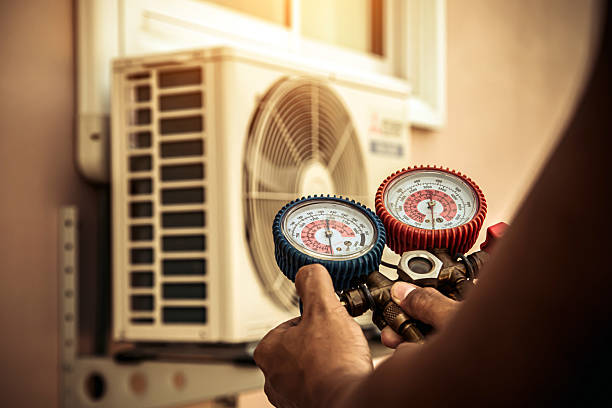 Professional Heat Pump Repair technician working in La Marque, TX